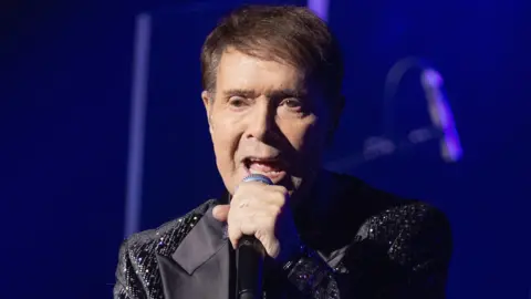 Getty Images Cliff Richard performs onstage during a concert at Royal Albert Hall on 8 December, 2025 in London