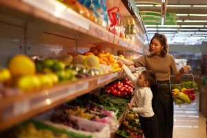 a-mother-and-a-child-in-a-market-choosing-fruit-and-vegetables.tmb-1200v.jpg